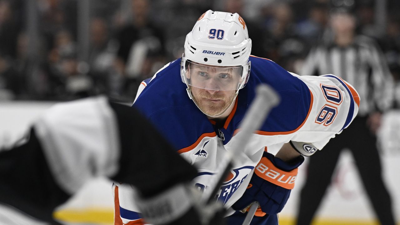 Edmonton Oilers right wing Corey Perry (90) watches a face off against the Los Angeles Kings during the third period of an NHL hockey game in Los Angeles, Saturday, April 5, 2025. (AP Photo/Alex Gallardo)