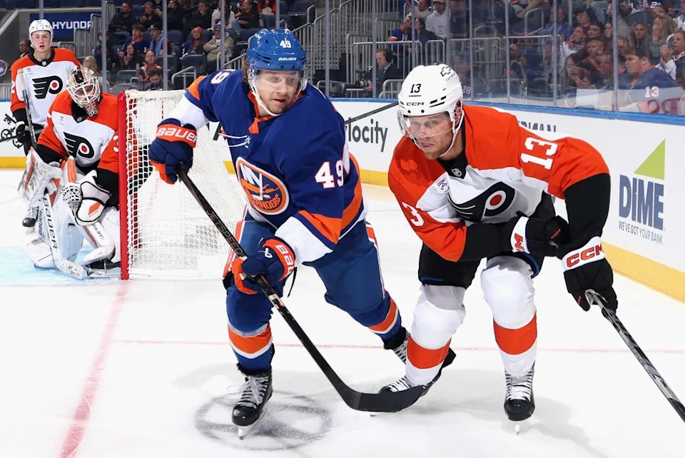 Maxim Shabanov #49 of the New York Islanders checks Adam Ginning #13 of the Philadelphia Flyers during the second period in a preseason game at UBS Arena on September 21, 2025 in Elmont. Getty Images