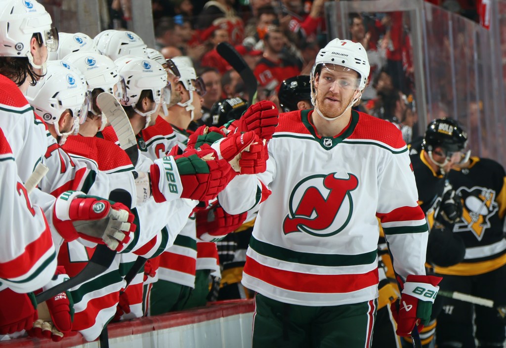 Dougie Hamilton of the New Jersey Devils celebrates a goal with teammates.