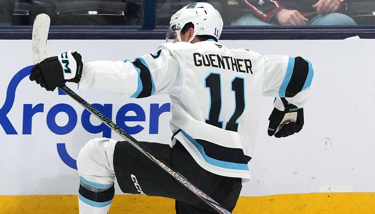 Utah Mammoth forward Dylan Guenther celebrating a goal during an NHL game, poised for his 2025-26 breakout season.