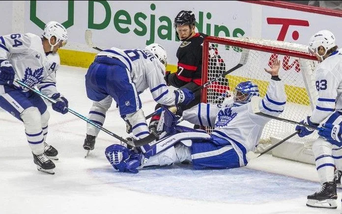  Ottawa Senators captain Brady Tkachuk is denied as Toronto Maple Leaf William Villeneuve goes tumbling over his goalie, Artur Akhtyamov, during the preseason opener at the Canadian Tire Centre on Sunday, Sept. 21, 2025.