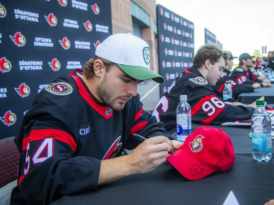 Tyler Boucher was part of the large group of players taking time to sign autographs for fans Sunday at Fan Fest.