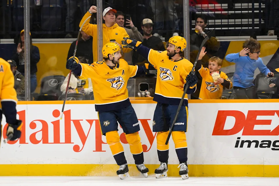Feb 3, 2025; Nashville, Tennessee, USA; Nashville Predators left wing Filip Forsberg (9) celebrates his goal with defenseman Roman Josi (59) against the Ottawa Senators during the second period at Bridgestone Arena. Mandatory Credit: Steve Roberts-Imagn Images
