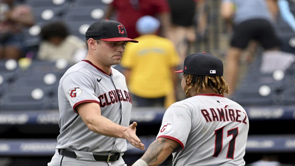 Cleveland Guardians pitcher Cade Smith, left, and José Ramírez (11) celebrate after their win over the Tampa Bay Rays in a baseball game Sunday, Sept. 7, 2025, in Tampa, Fla. (AP Photo/Jason Behnken)