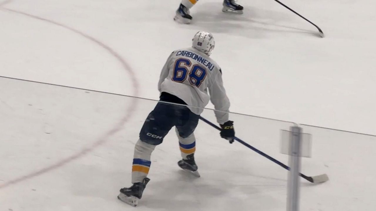 Carbonneau skating with the Blues