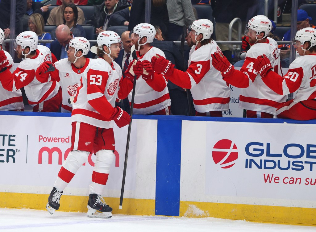 Detroit Red Wings players celebrating a goal.