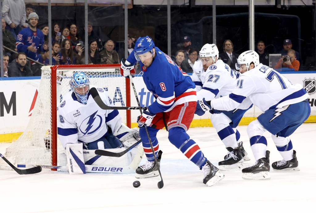Tampa Bay Lightning goalie Andrei Vasilevskiy defending the net against New York Rangers.