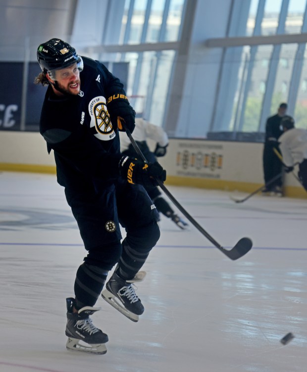 Bruins star David Pastrnak takes a shot on goal during a captains' practice at Warrior Ice Arena. (Nancy Lane/Boston Herald)