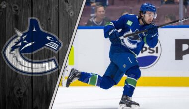 Vancouver Canucks captain Quinn Hughes skating during an NHL game, looking focused on the play