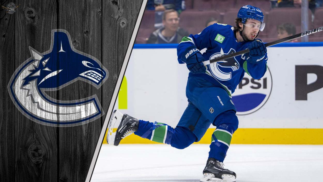 Vancouver Canucks captain Quinn Hughes skating during an NHL game, looking focused on the play