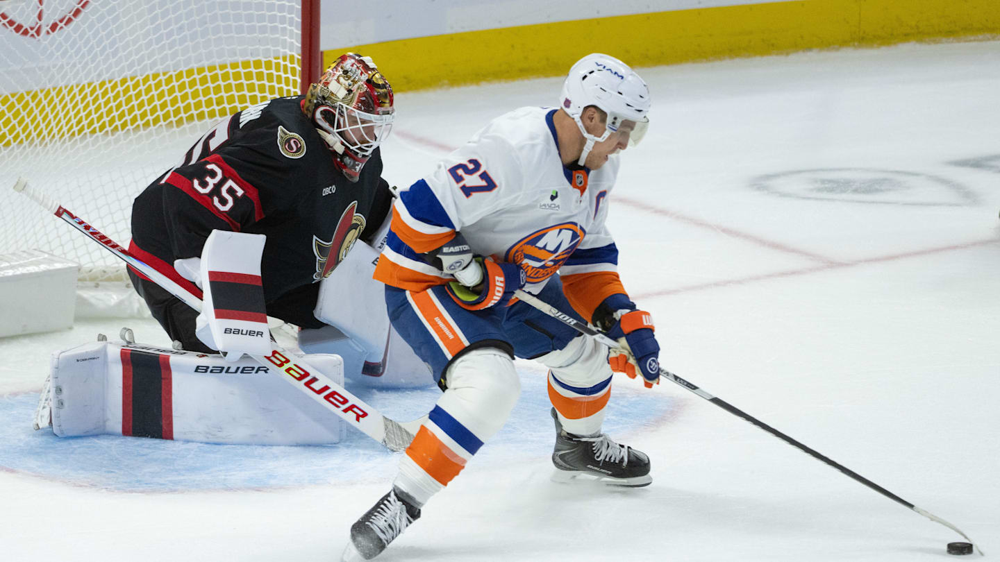 Oct 18, 2025; Ottawa, Ontario, CAN; New York Islanders left wing Anders Lee (27) skates unckecked with the puck in front of Ottawa Senators goalie Linus Ullmark (35) in the third period at the Canadian Tire Centre. Mandatory Credit: Marc DesRosiers-IMAGN Images