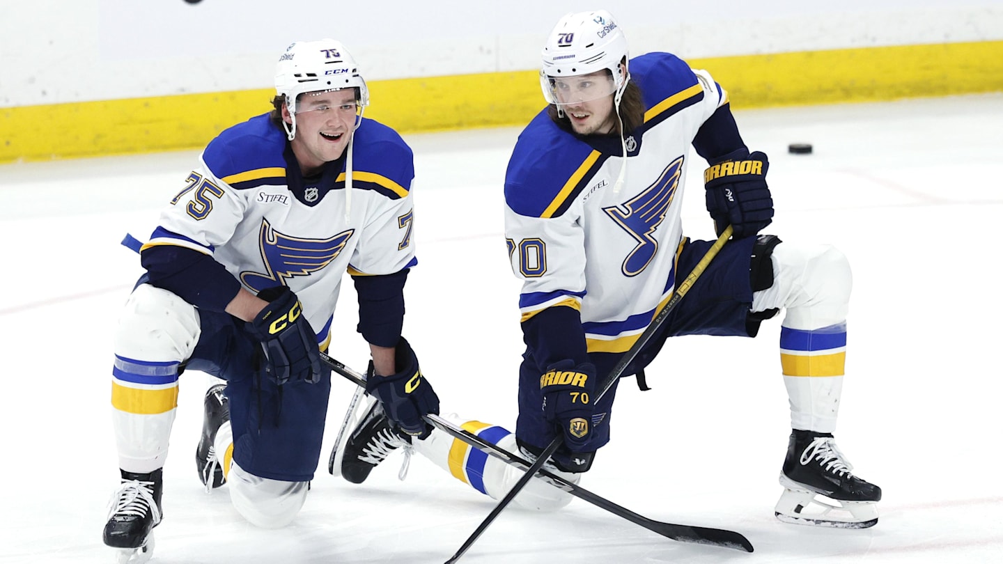 Apr 7, 2025; Winnipeg, Manitoba, CAN; St. Louis Blues defenseman Tyler Tucker (75) and St. Louis Blues center Oskar Sundqvist (70) talk before a game against the Winnipeg Jets at Canada Life Centre. Mandatory Credit: James Carey Lauder-Imagn Images