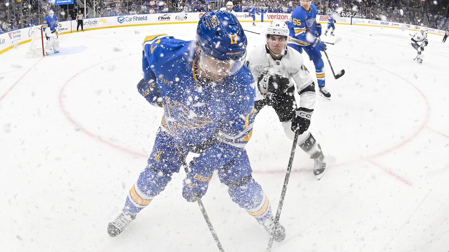 Oct 21, 2025; St. Louis, Missouri, USA; St. Louis Blues defenseman Cam Fowler (17) battle Los Angeles Kings right wing Alex Laferriere (14) for the puck during the first period at Enterprise Center. Mandatory Credit: Jeff Curry-Imagn Images
