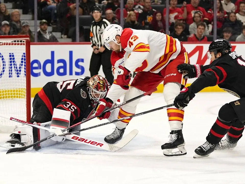  Senators goaltender Linus Ullmark makes a save on Flames forward Adam Klapka on Thursday.