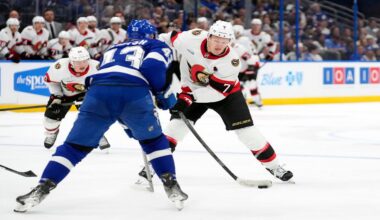 Ottawa Senators left wing Brady Tkachuk (7) shoots in front of Tampa Bay Lightning defenseman Darren Raddysh (43) during the third period of an NHL hockey game Thursday, Oct. 9, 2025, in Tampa, Fla. (AP Photo/Chris O'Meara)