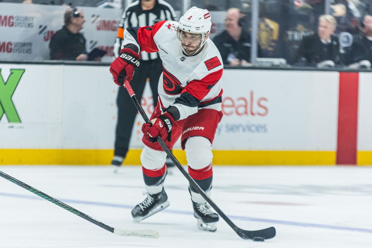 Carolina Hurricanes D Shayne Gostisbehere (4) shoots the puck during an NHL game against the Anaheim Ducks on October 16, 2025 in Anaheim, CA.