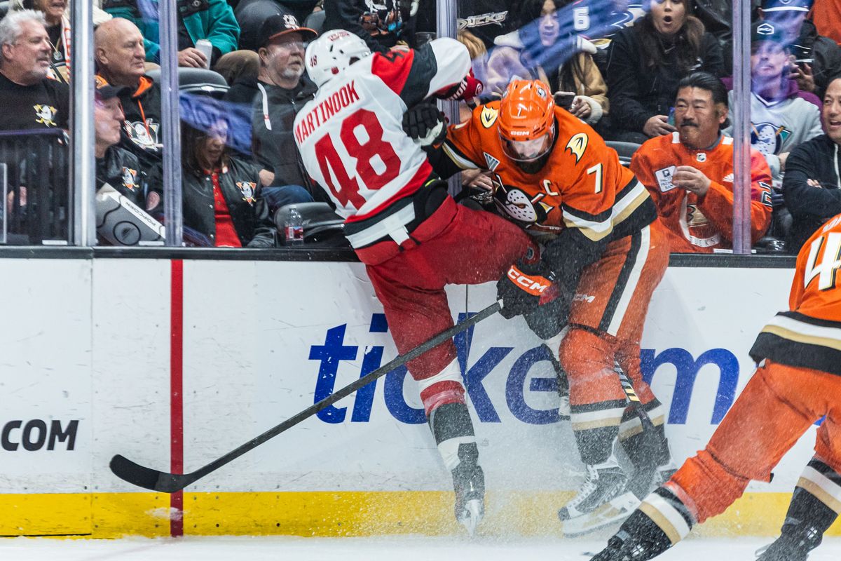 Carolina Hurricanes L Jordan Martinook (28) and Anaheim Ducks D Radko Gudas (7) slam into each other during an NHL Carolina Hurricanes against the Anaheim Ducks game on October 16, 2025 in Anaheim, CA.