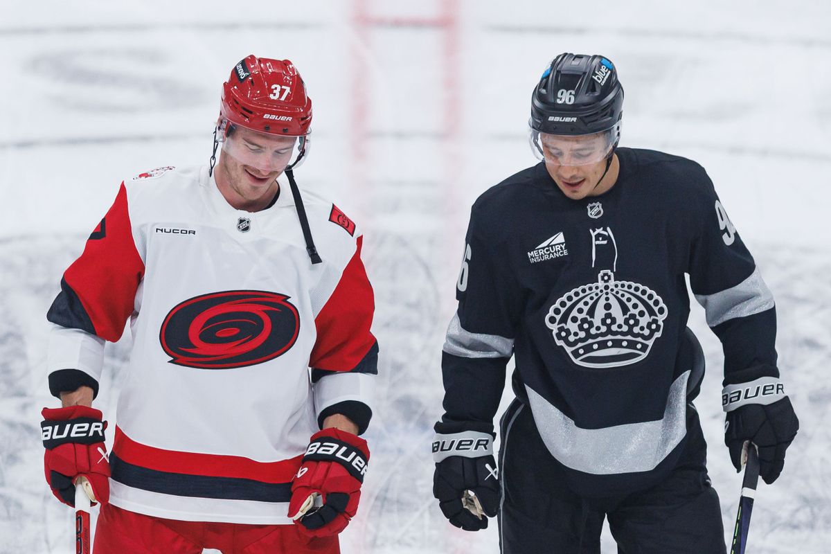 Los Angeles Kings LW Andrei Kuzmenko (96) and Carolina Hurricanes RW Andrei Svechnikov (37) talks to eachotehr during an NHL Los Angeles Kings against the Carolina Hurricanes game at the Crypto.com Arena on October 18, 2025 in Los Angeles, California.
