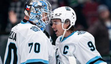 FILE - Utah Hockey Club goaltender Karel Vejmelka (70) and Clayton Keller (9) celebrate after defeating the Vancouver Canucks in an NHL hockey game in Vancouver, British Columbia, Sunday, March 16, 2025. (Ethan Cairns/The Canadian Press via AP, File)