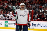 FILE - Washington Capitals' Alex Ovechkin (8) watches the puck against the Carolina...