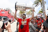 Florida Panthers Seth Jones carries the Stanley Cup during the NHL hockey team's Stanley Cup...