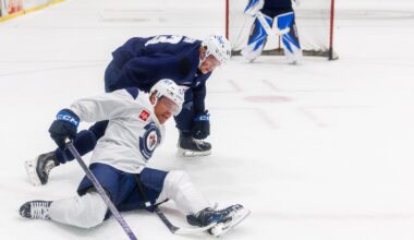 MIKE DEAL / FREE PRESS Winnipeg Jets’ Mason Shaw (23) slips during a battle for the puck with Dylan Anhorn (83) during training camp at Hockey For All Centre this September. Shaw was loaned to the Manitoba Moose for their training camp last week.