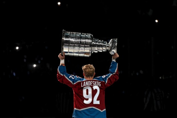 Gabriel Landeskog (92) of the Colorado Avalanche hoists the Stanley Cup during a championship celebration before the first period against the Chicago Blackhawks at Ball Arena in Denver on Wednesday, October 12, 2022. (Photo by AAron Ontiveroz/The Denver Post)
