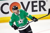 Dallas Stars right wing Mikko Rantanen circles the ice after scoring a hat trick goal in the...