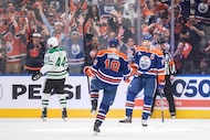 Dallas Stars' Cody Ceci (44) skates past as Edmonton Oilers' Zach Hyman (18) and Connor...