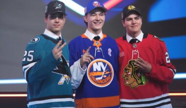 FILE - Matthew Schaefer, drafted first by the New York Islanders, middle, stands between Michael Misa, drafted second by the San Jose Sharks, left, and Anton Frondell, drafted third by the Chicago Blackhawks, during the NHL hockey draft June 27, 2025, in Los Angeles. (AP Photo/Damian Dovarganes, File)