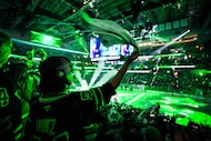 Dallas Stars fans cheer as their team takes the ice before Game 3 of a second-round NHL...