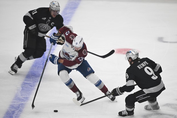 The Kings’ Adrian Kempe (9) takes a shot on goal...