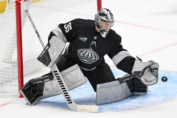 Kings goaltender Darcy Kuemper makes a glove save during the...