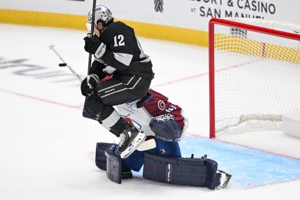 The Kings’ Trevor Moore (12) jumps to try and let...