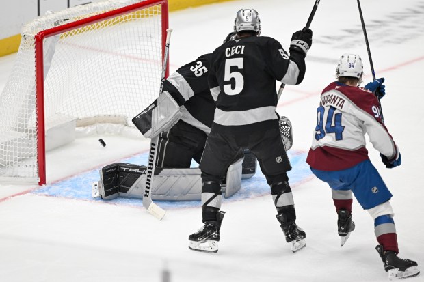 The Colorado Avalanche’s Joel Kiviranta (94) scores as Kings goaltender...