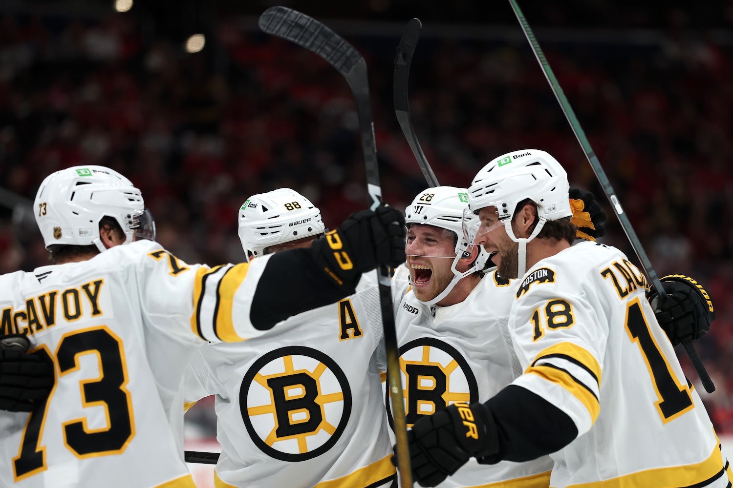 WASHINGTON, DC - OCTOBER 08: Elias Lindholm #28 of the Boston Bruins celebrates with teammates after scoring a goal against the Washington Capitals during the third period at Capital One Arena on October 8, 2025 in Washington, DC. (Photo by Patrick Smith/Getty Images)