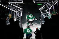 Dallas Stars center Tyler Seguin (91) and left wing Jamie Benn (14) take the ice for the...