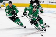 Dallas Stars left wing Jason Robertson (21) skates up the ice during the third period of an...
