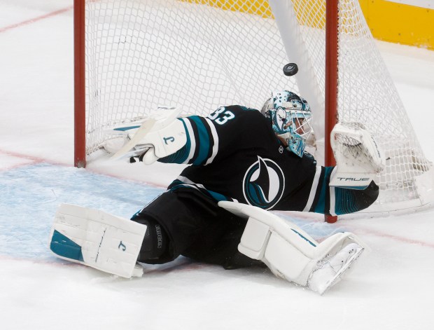 San Jose Sharks goaltender Alex Nedeljkovic (33) blocks a shot...