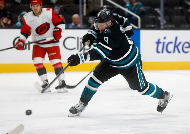 San Jose Sharks' Dmitry Orlov (9) takes a shot against...
