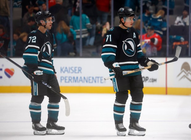 San Jose Sharks' Macklin Celebrini (71) and San Jose Sharks'...