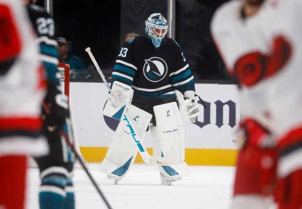 San Jose Sharks goaltender Alex Nedeljkovic (33) heads off the...