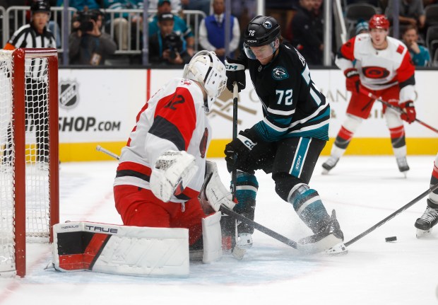 San Jose Sharks' William Eklund (72) tries to get a...