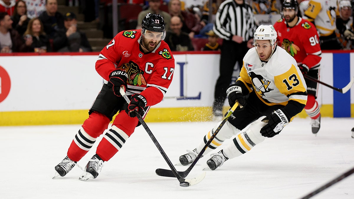 Nick Foligno battles for the puck