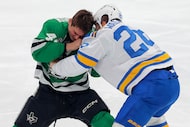 Dallas Stars forward Justin Hryckowian (49) gets into a fight with St. Louis Blues forward...