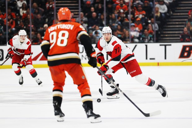 Carolina Hurricanes left wing Mark Jankowski (77) moves the puck...