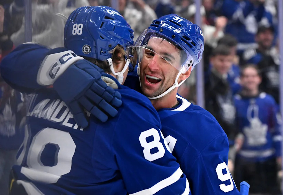 Toronto Maple Leafs forward John Tavares (91) celebrates with forward William Nylander (88).Dan Hamilton-Imagn Images
