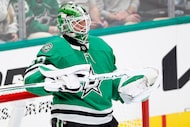 Dallas Stars goaltender Jake Oettinger (29) cleans his stick during the second period at the...