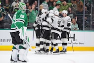 The Los Angeles Kings celebrate the winning goal by right wing Adrian Kempe (9) as Dallas...