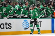 Dallas Stars center Tyler Seguin skates by his bench after scoring a goal against the...
